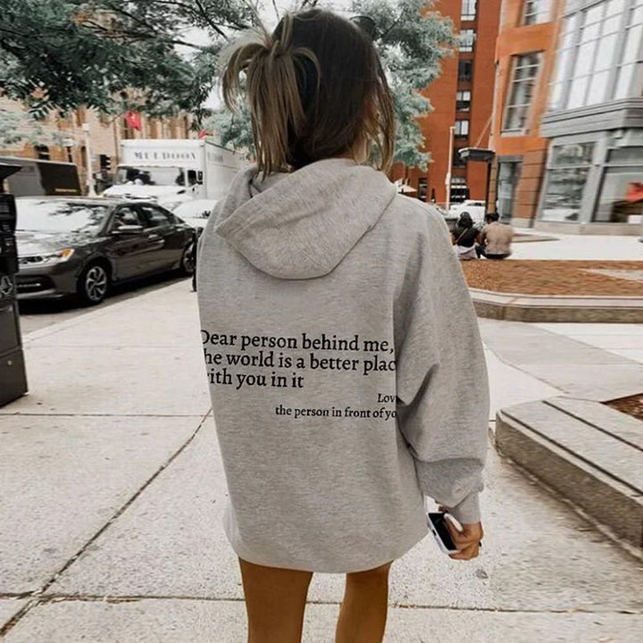 Comfortable women's pullover hoodie, long sleeve, featuring a heartwarming positive message.