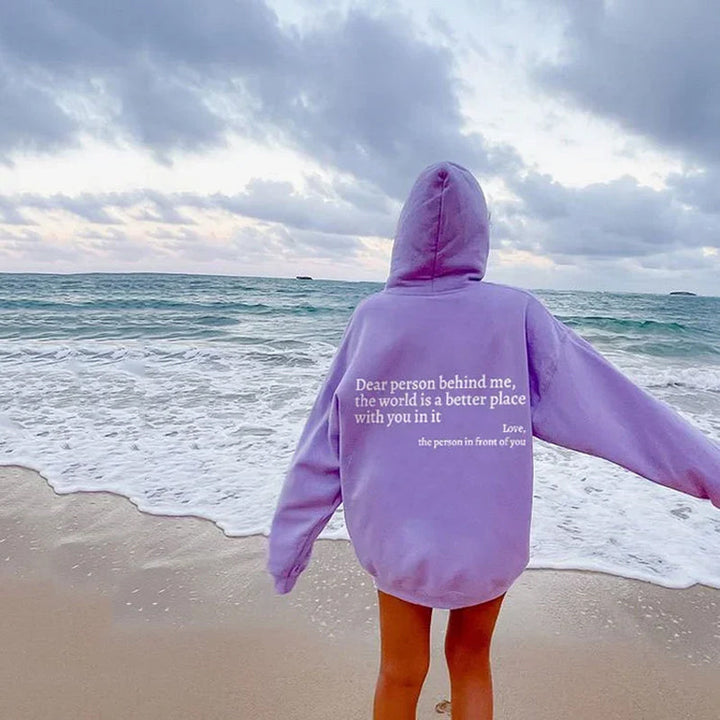 Stylish women's inspirational pullover hoodie, featuring a heartwarming positive message design.