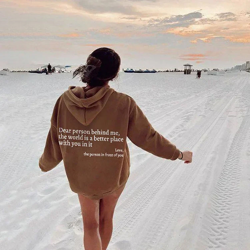 Heartwarming women's hoodie, a stylish pullover with an inspirational positive message design.