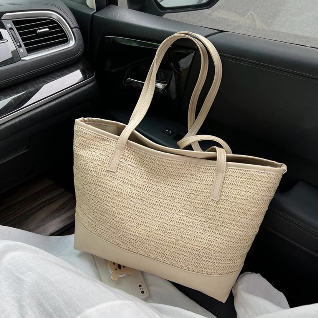 Beige woven shoulder tote bag for women, a large and casual everyday accessory.