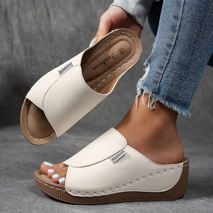 Stylish women's open-toe slip-on wedge sandals, perfect for casual summer fashion and everyday wear.