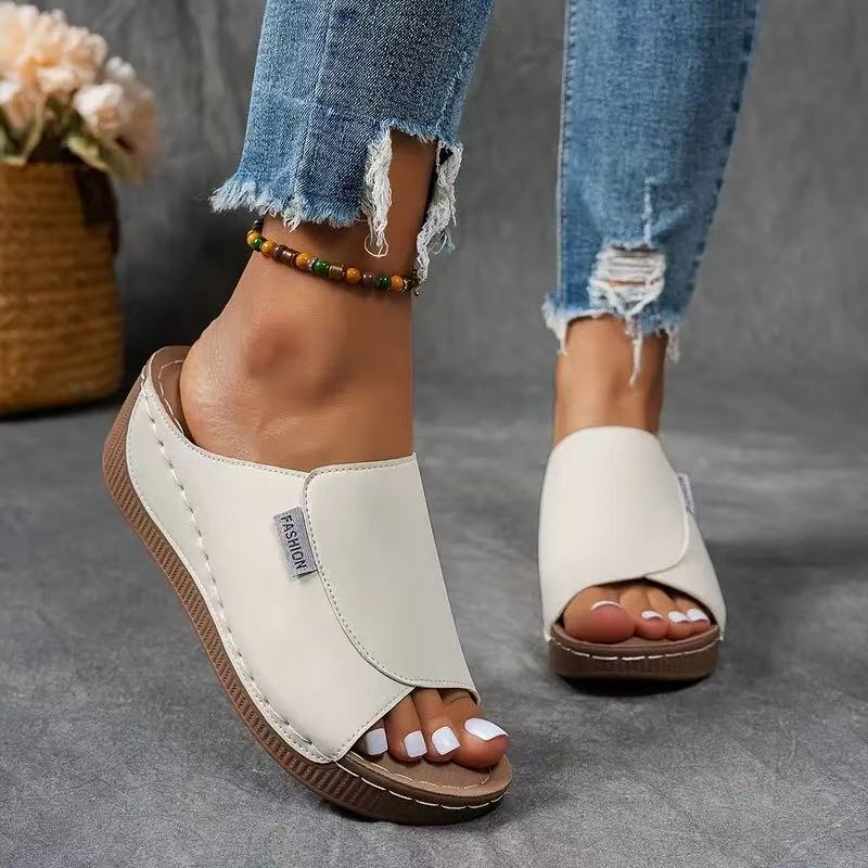 Comfortable women's slip-on wedge sandals with an open toe, ideal platform summer shoes for casual wear.