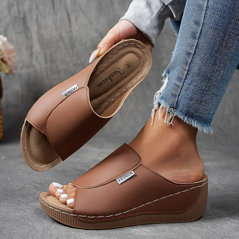 Fashionable women's open-toe wedge sandals, slip-on design for easy wear, great for summer comfort.