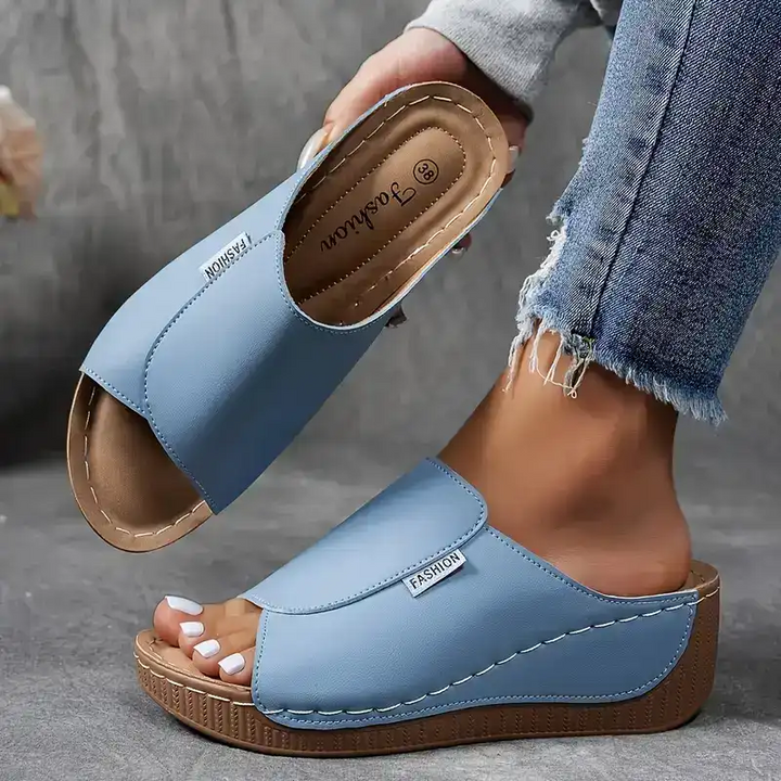 Lightweight women's slip-on wedge sandals with open toe, a comfortable choice for summer casual fashion.