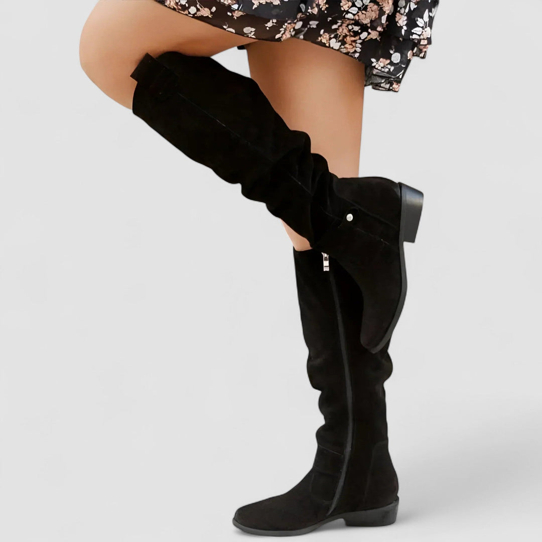 Back view of women's orthopedic ankle boots with sturdy heel & easy zipper, providing secure support.