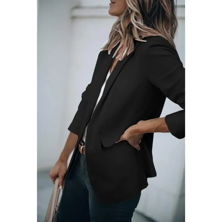 Modern women's puff sleeve blazer. Plain design offers versatile styling for office, business casual, or fashion outerwear.