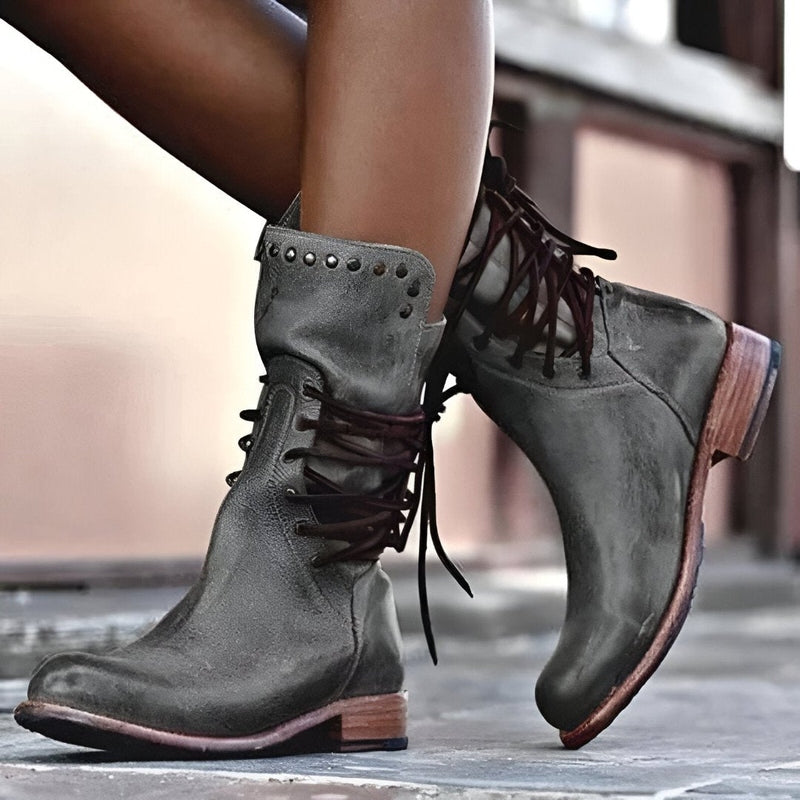 Comfortable and stylish women's studded mid-calf boots, lace-up design, ideal for winter fashion.