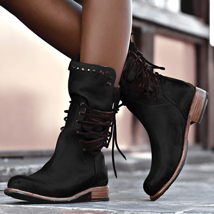 Women's rugged studded lace-up mid-calf boots, low heel for everyday stylish comfort.