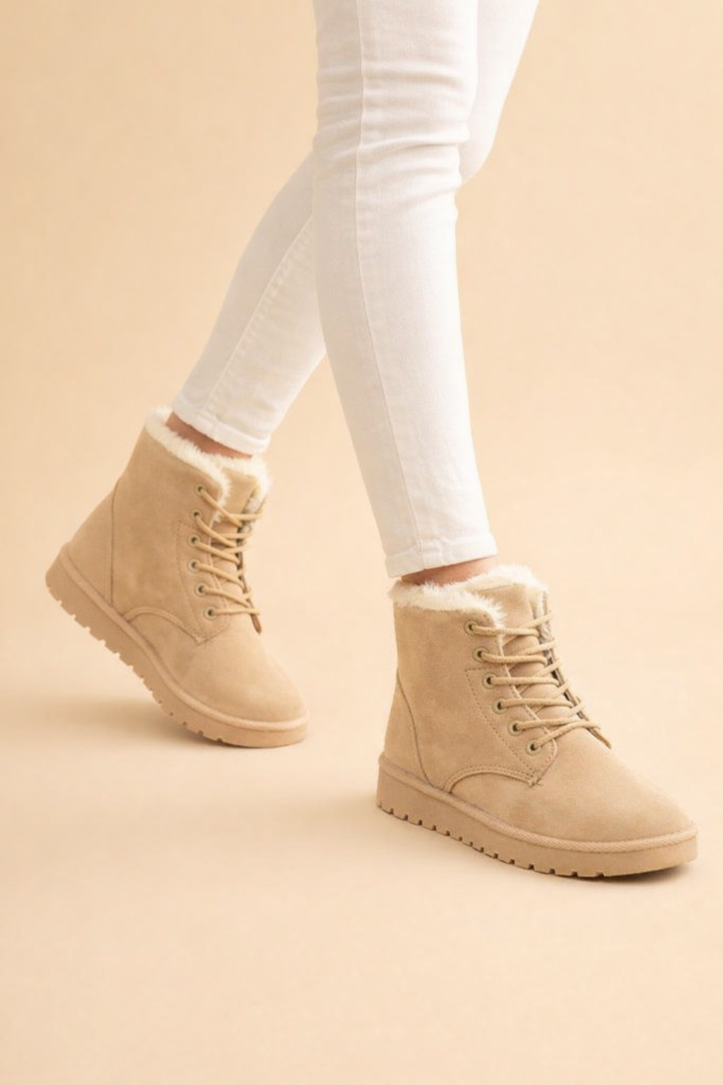 Side profile of women's warm winter ankle boots, featuring stylish design and cozy cold weather comfort.