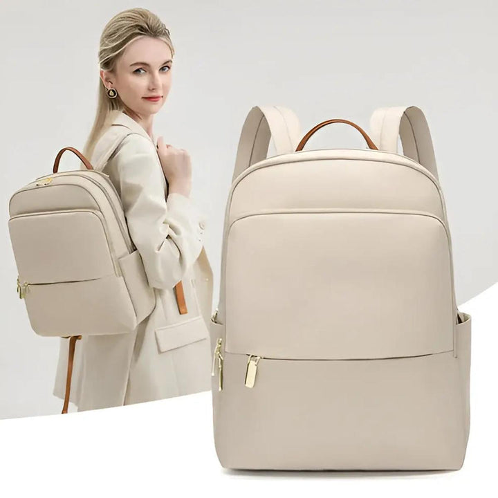 Sleek black women's waterproof laptop backpack for office, school, and urban adventures.