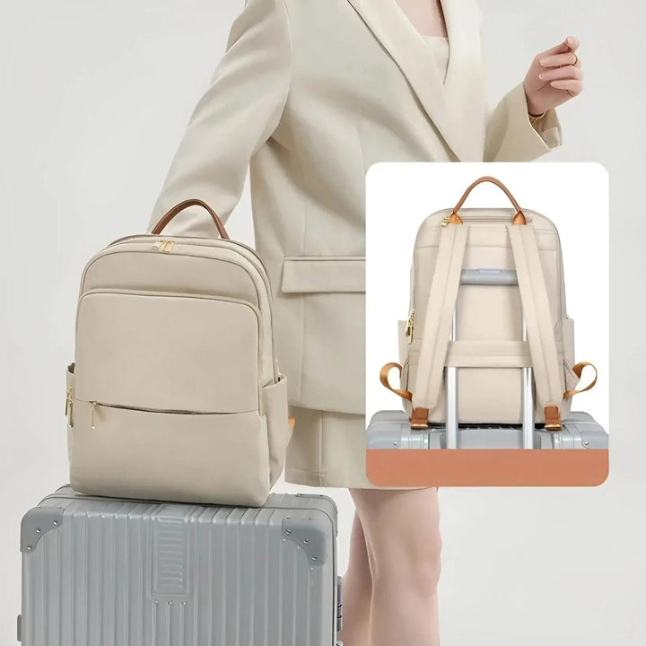 Beige women's waterproof laptop backpack, ideal for travel, work, and everyday carry.