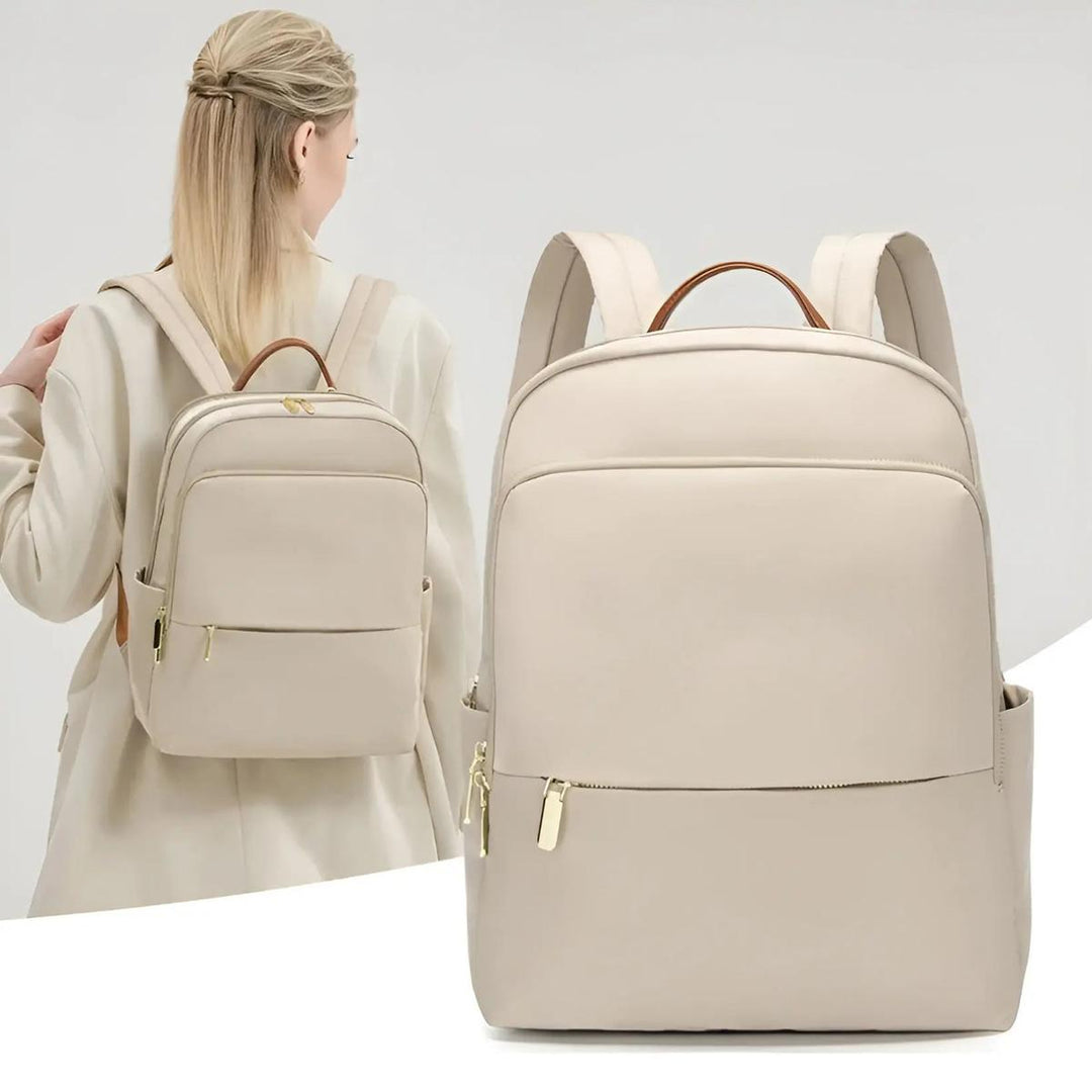 Protective grey women's laptop backpack, waterproof design for commuters and students.