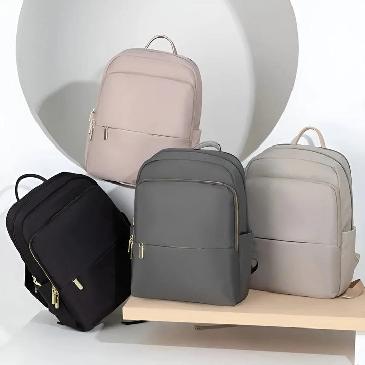 Fashionable pink women's waterproof backpack with laptop sleeve, perfect for travel.