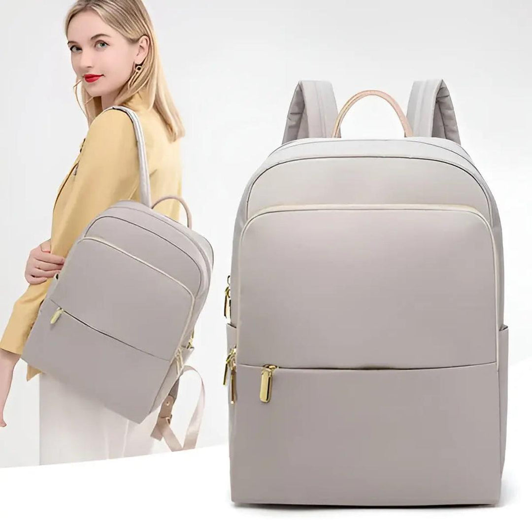 Waterproof women's laptop backpack in beige, stylish and practical for daily journeys.