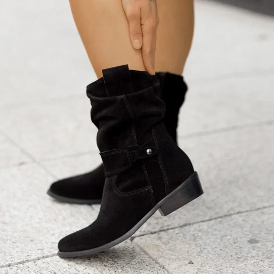 Stylish women's western ankle boots with decorative buckles, low heel, and side zip for comfortable everyday wear.