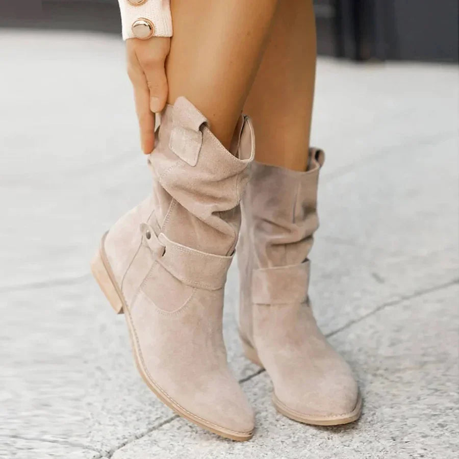 Fashionable cowgirl ankle boots for women, featuring western buckles, a convenient zip closure, and comfortable low heel.