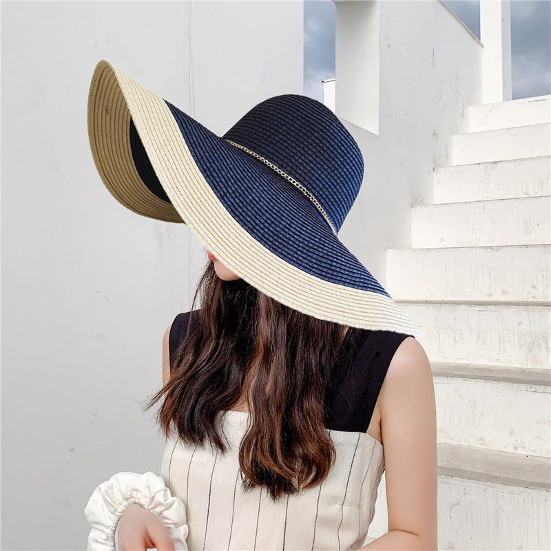 Stylish women's wide brim summer hat offering excellent UV sun protection, perfect for beach or travel.
