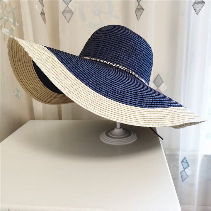 Chic women's wide brim summer hat with UV protection, a must-have fashion accessory for beach and outdoor wear.