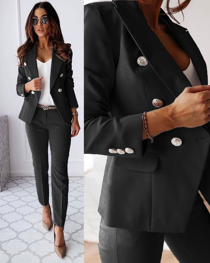 Stylish women's double-breasted suit with metallic buttons and tailored fit; perfect for corporate or formal settings.