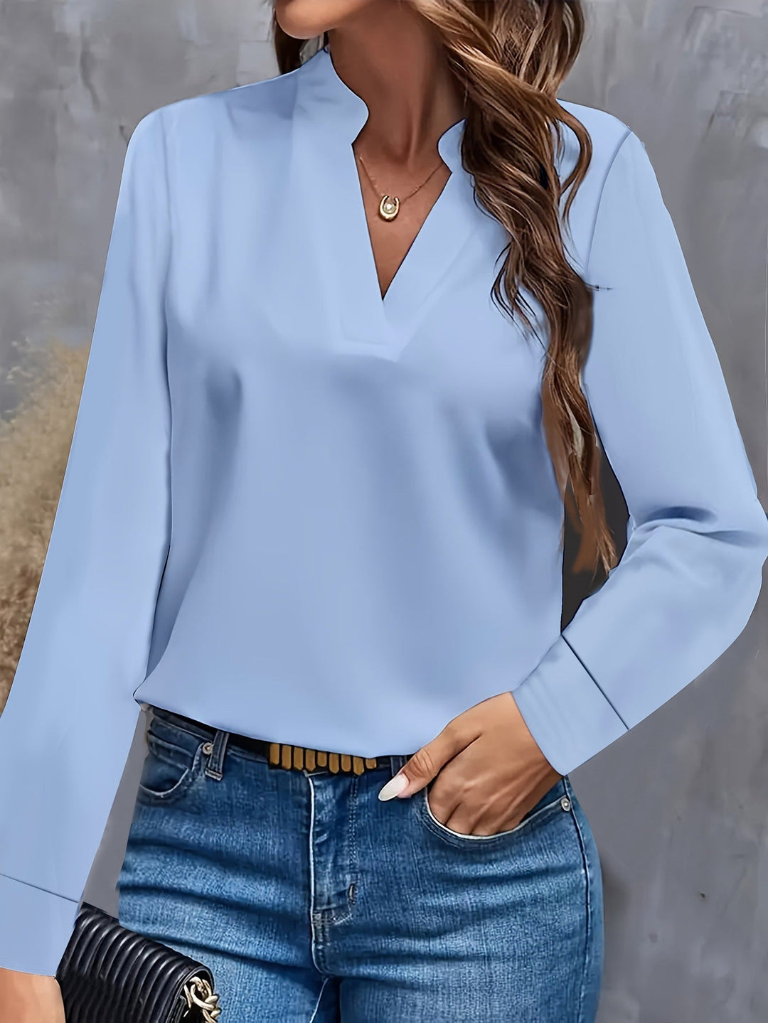 "Stylish women's V-neck blouse, light flowy fit, flattering silhouette, versatile for casual or formal occasions."