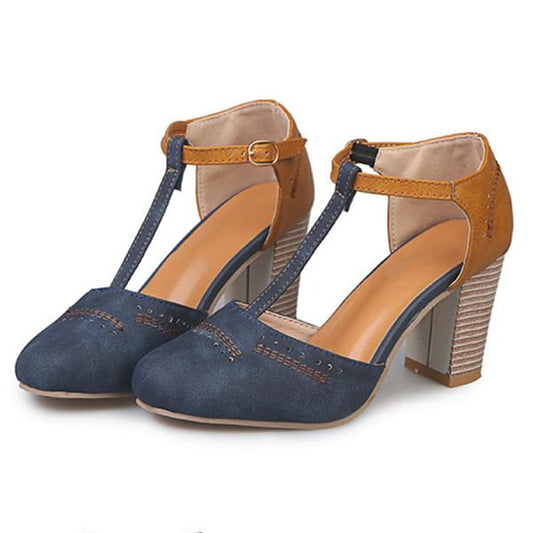 "T-Strap block heels with vintage charm, closed round toe, adjustable ankle buckle, faux suede finish."