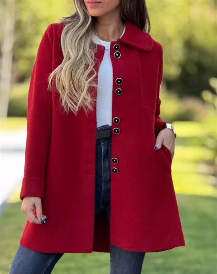 Tailored women's coat with structured silhouette, thigh-length, single-breasted, ideal for business casual wear.