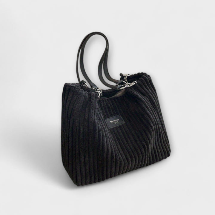 Elegant women's shoulder bag with a modern, trendy style. Versatile everyday handbag & fashion accessory.