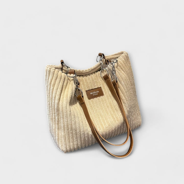 Organized women's shoulder bag, modern and trendy. Lightweight versatile handbag for everyday chic style.