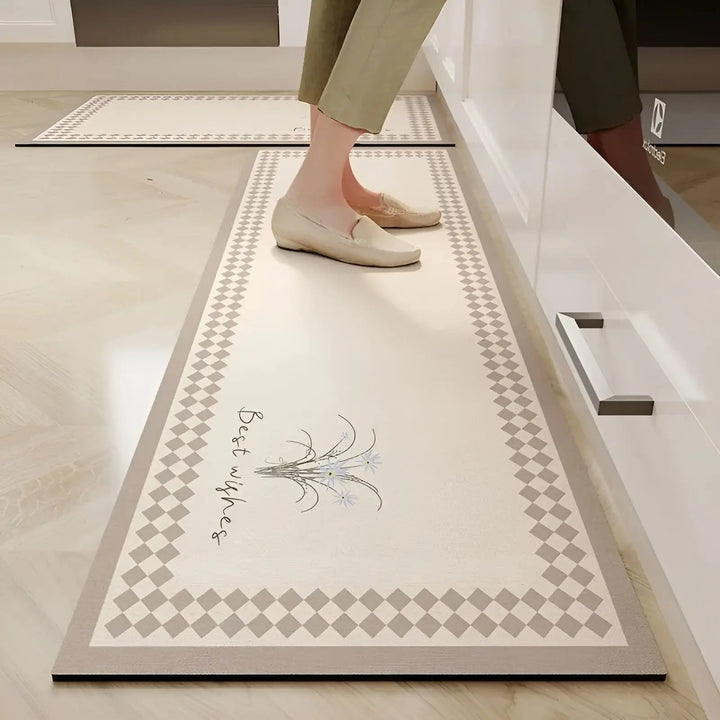 Ultra-absorbent non-slip kitchen mat for safety & cleanliness, protecting floors from spills. Easy to clean PVC comfort.