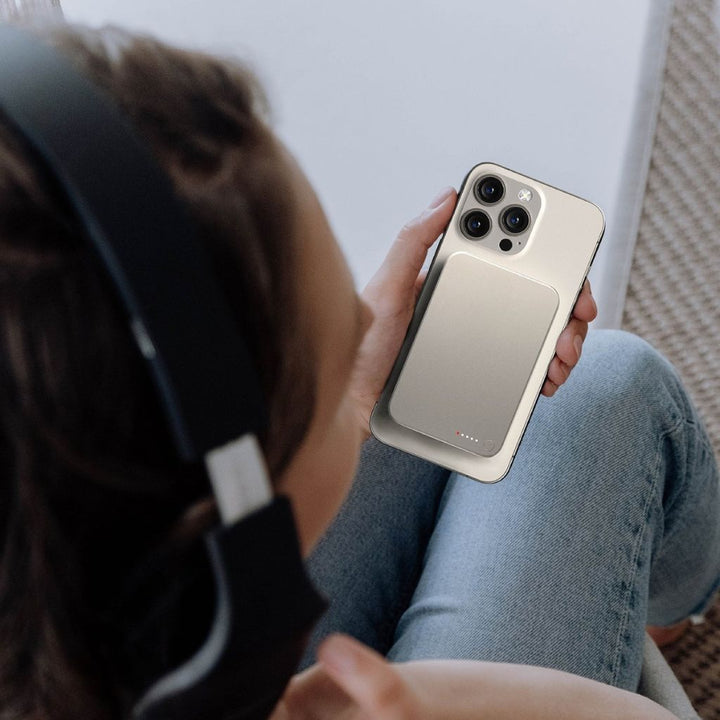 Ultra-slim aluminum power bank with sleek design, available in black, gray, or purple; ideal for portable device charging.