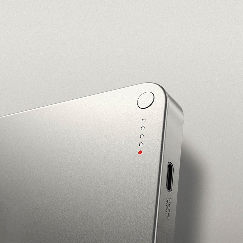 Ultra-slim aluminum power bank with sleek design, available in black, gray, or purple; ideal for portable device charging.