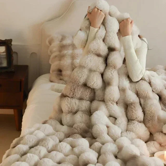 "Ultra-soft faux fur throw blanket, plush texture, beige cream tones, cozy decoration for sofa or bed."