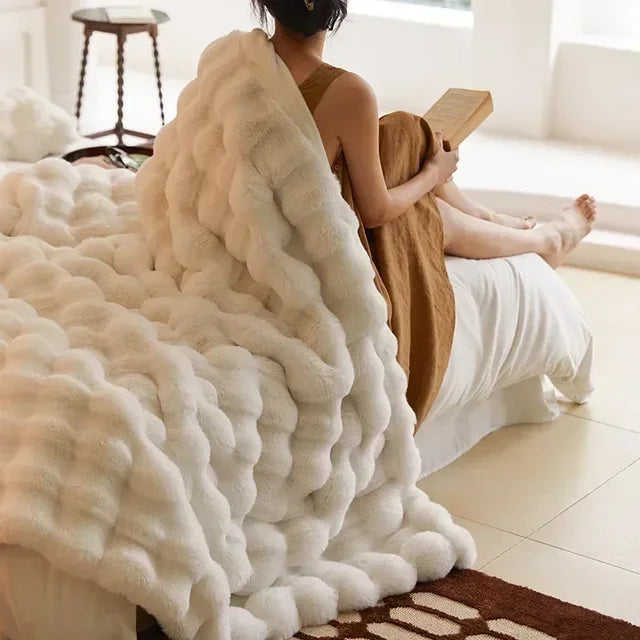 "Ultra-soft faux fur throw blanket, plush texture, beige cream tones, cozy decoration for sofa or bed."
