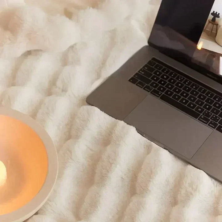 "Ultra-soft faux fur throw blanket, plush texture, beige cream tones, cozy decoration for sofa or bed."