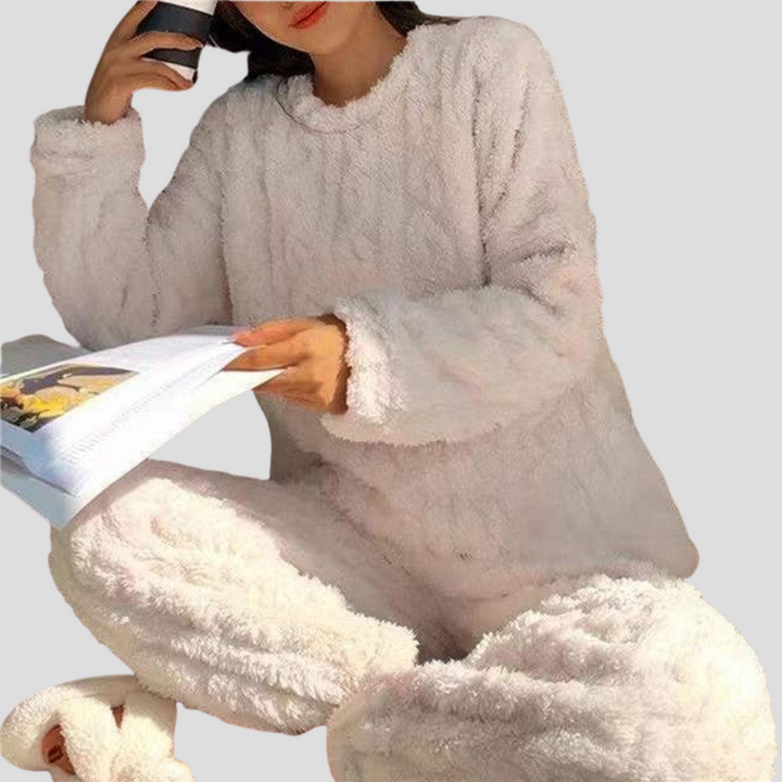 Model wearing ultra-soft women's fleece pajama set, ideal for cozy winter loungewear and sleep.