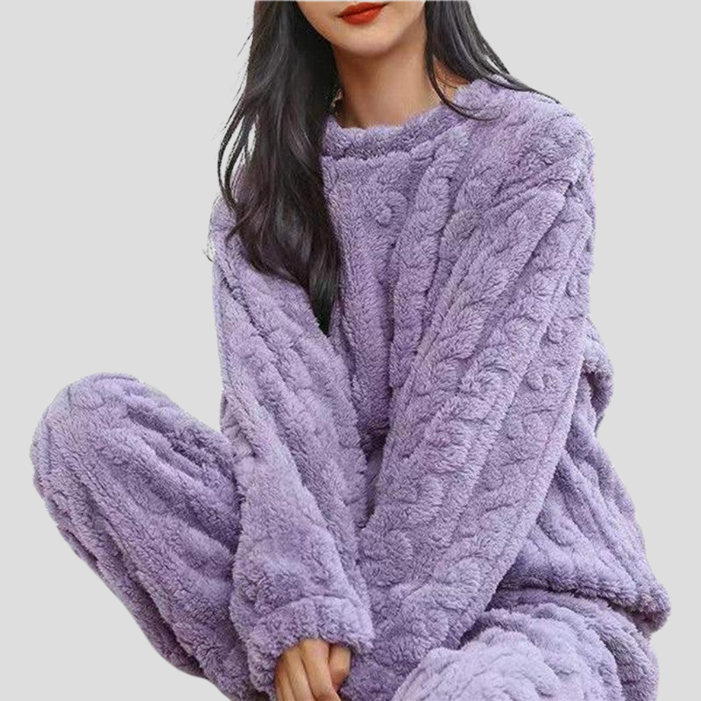 Cozy women's fleece pajama set, ultra-soft loungewear for comfortable sleepwear and warmth.