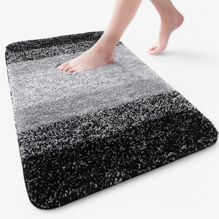 Luxurious UltraAbsorb microfiber bath mat, super absorbent for dry feet, soft comfort in bathroom.