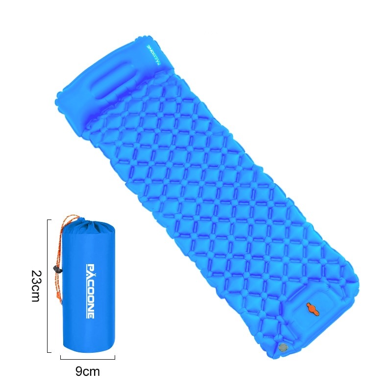 Hiker resting comfortably on an ultralight inflatable camping mat during a wilderness trip.