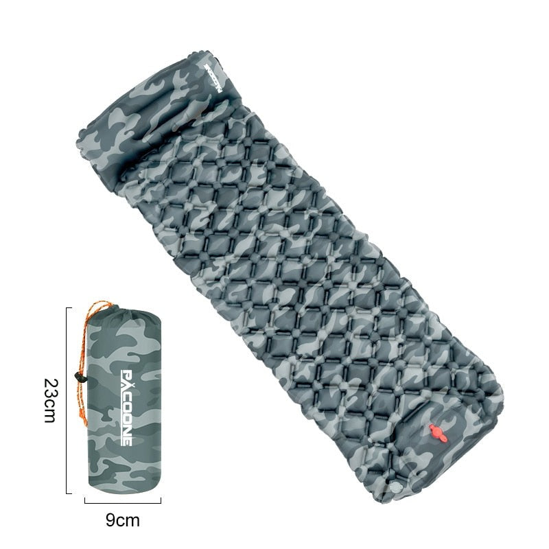 Integrated foot pump inflating a portable ultralight sleeping pad for effortless camp setup.