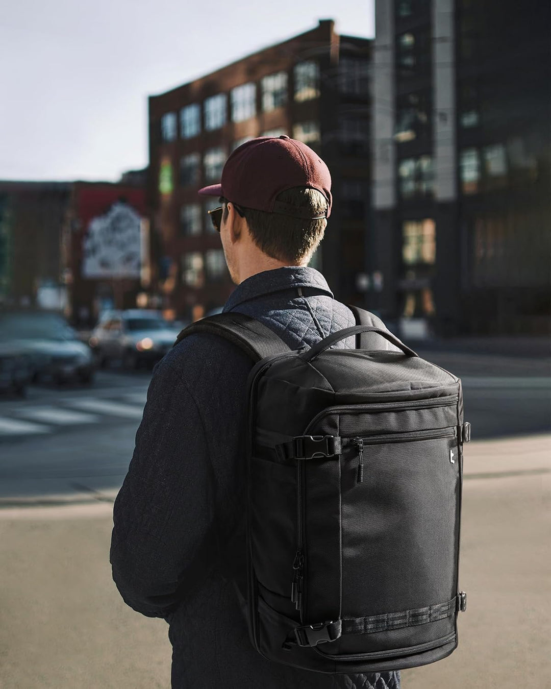Unisex 38L TSA-friendly carry-on travel backpack for airport & weekend trips. Features laptop compartment.