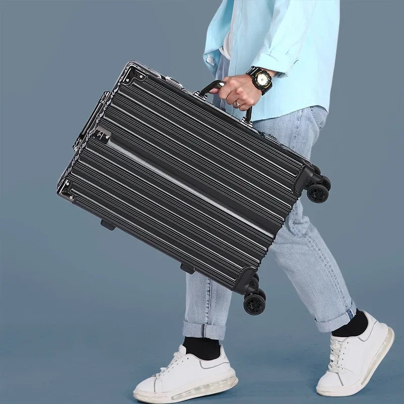 Carry-on aluminium frame hardshell suitcase with smooth spinner wheels, ideal for business travel.