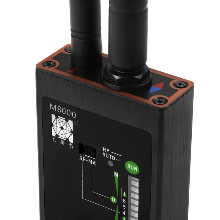 Compact anti-spy detector to find hidden cameras, RF bugs, & wiretaps for personal security.