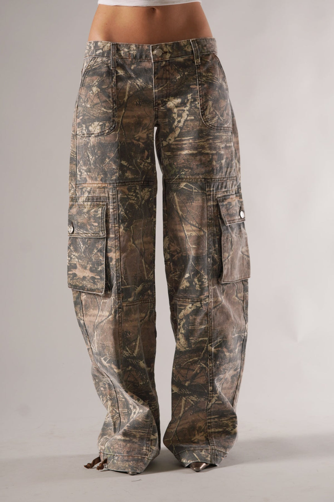 Unisex camo cargo pants with rugged utility pockets, featuring a relaxed fit and bold camo print for urban or outdoor style.