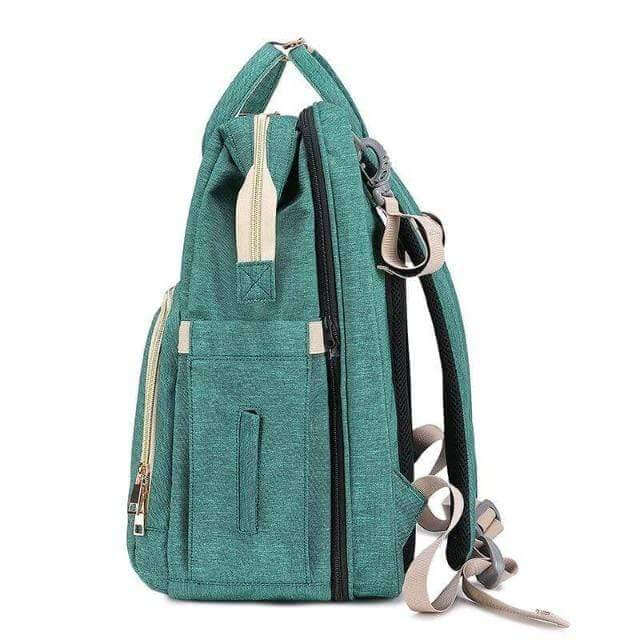 Unisex waterproof baby bag with multi-pocket organization and integrated bassinet for ultimate convenience.