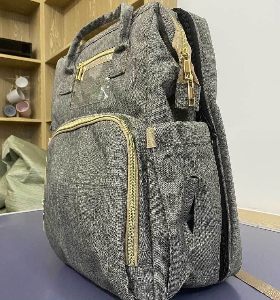 Convertible diaper bag with bassinet function, perfect for on-the-go parents and baby travel adventures.
