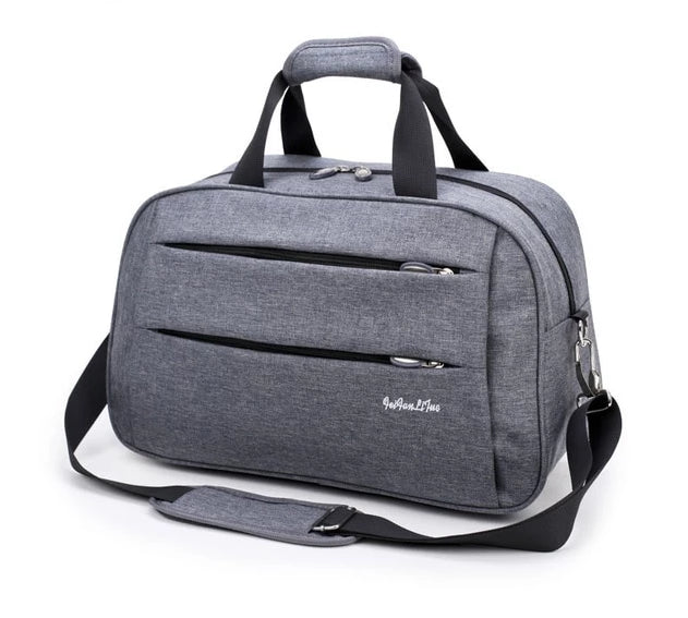 Unisex travel bag being carried at an airport. Convertible carry-on luggage, water-resistant & practical.