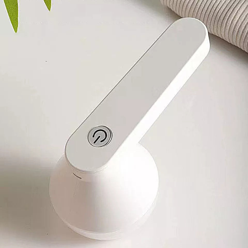 Unisex cordless fabric shaver & lint remover. Rechargeable tool for sweaters, clothing, and upholstery care.