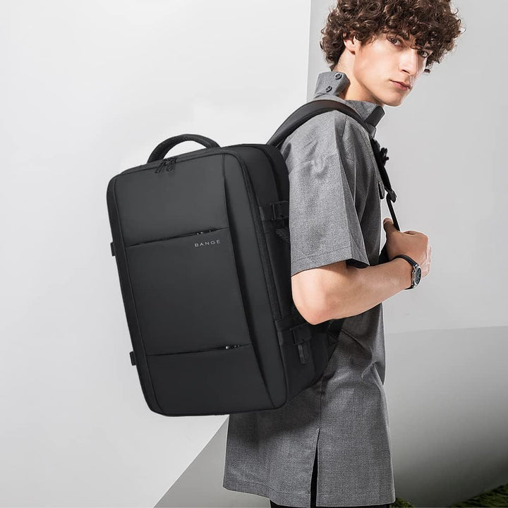 Compact 26L travel backpack, unexpanded view. Waterproof, anti-theft, with accessible laptop sleeve.