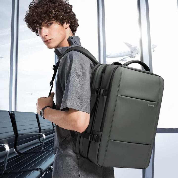 Versatile 26-45L expandable travel backpack, waterproof, anti-theft, ideal for any trip with laptop.