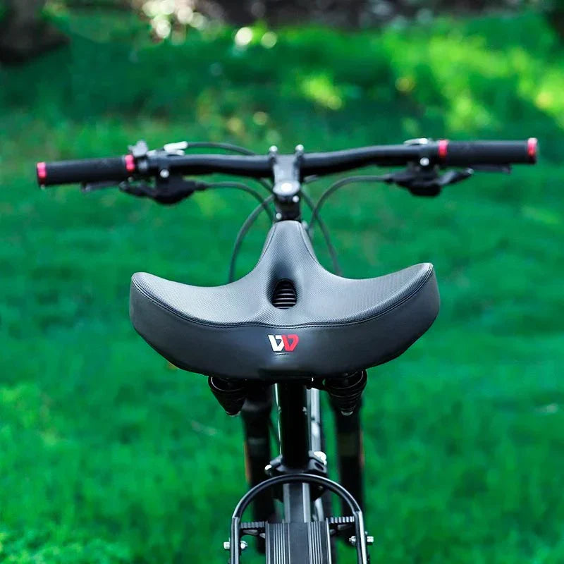 Ergonomic wide bicycle saddle with memory foam, a comfortable & durable bike accessory for long rides.